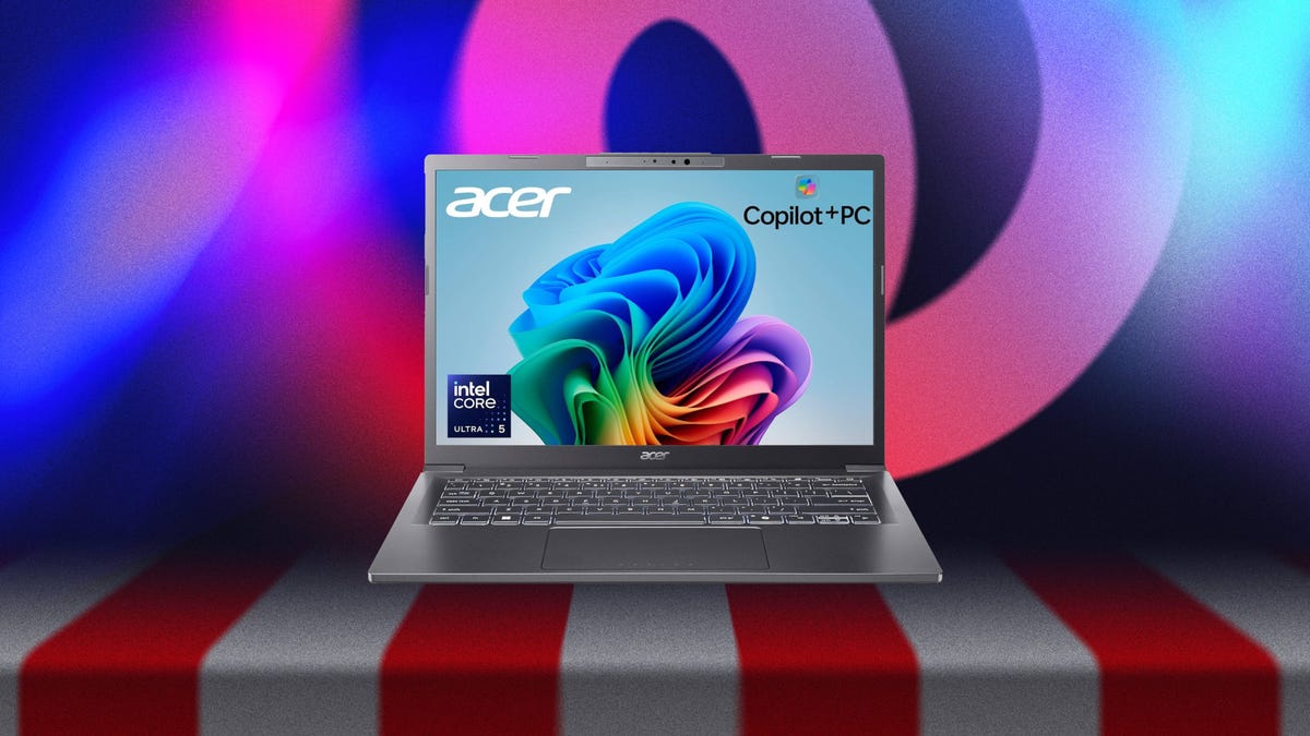 A gray laptop against a red, white and blue striped background.