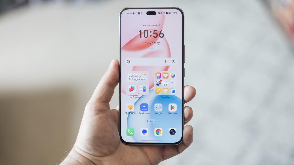 Image of a hand holding a phone showing the screen on