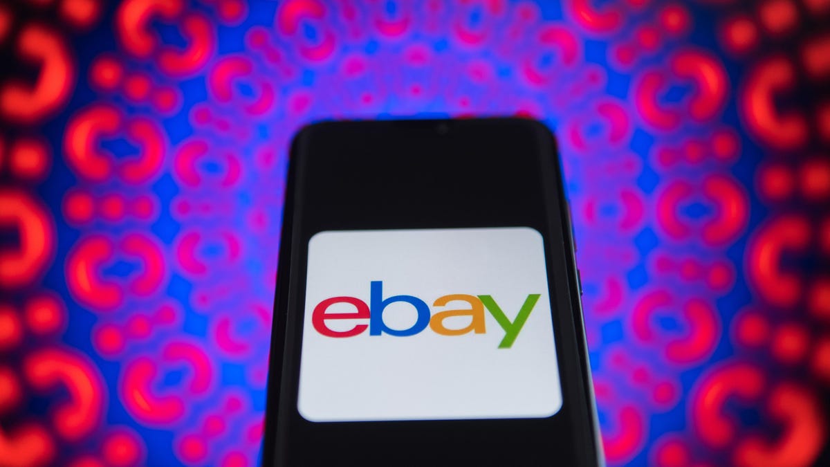 An Ebay logo is seen on a mobile phone
