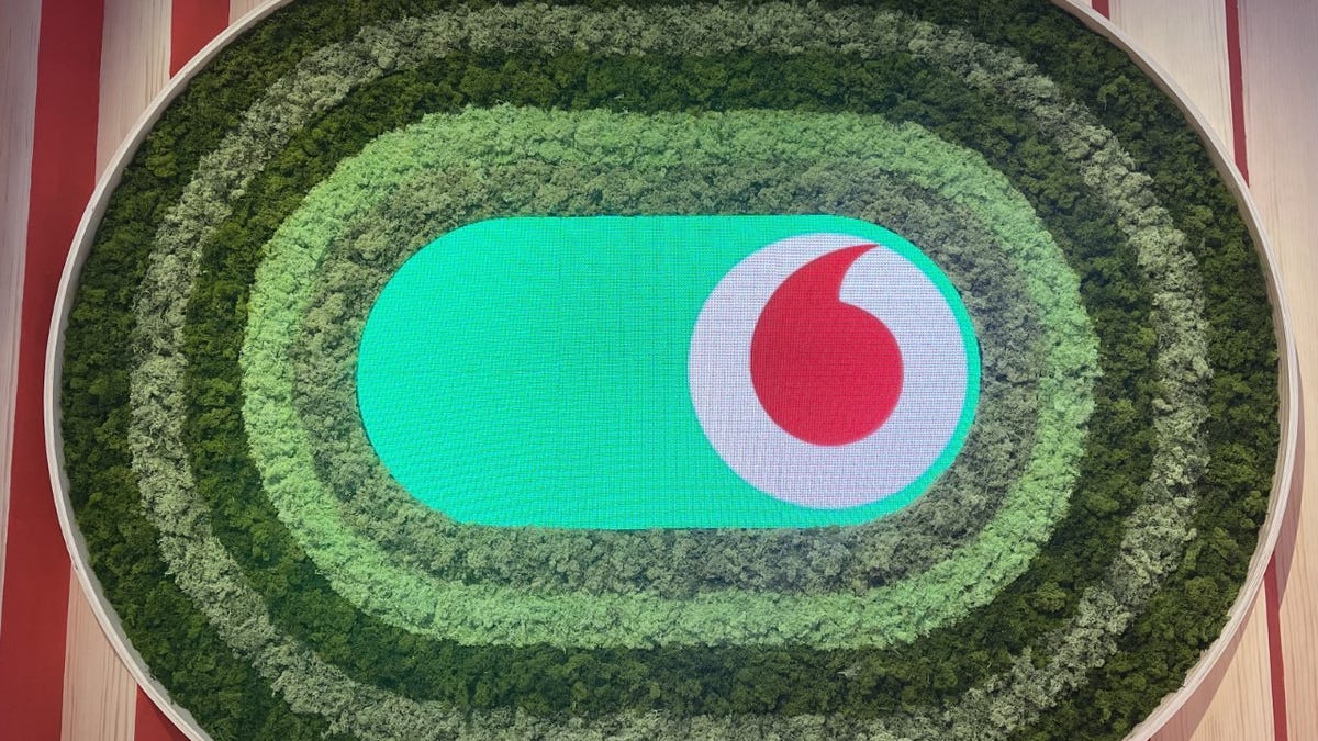 Vodafone logo surrounded by foliage