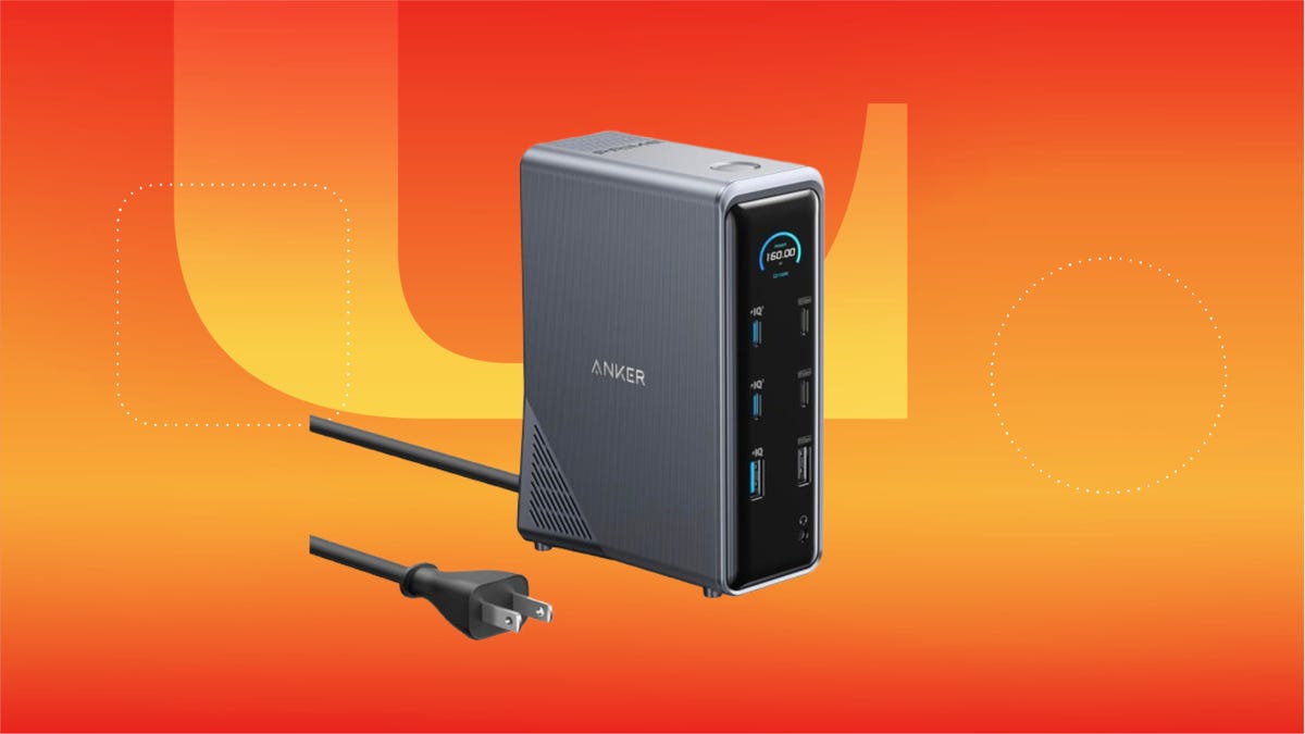 Black Anker docking station against orange background.