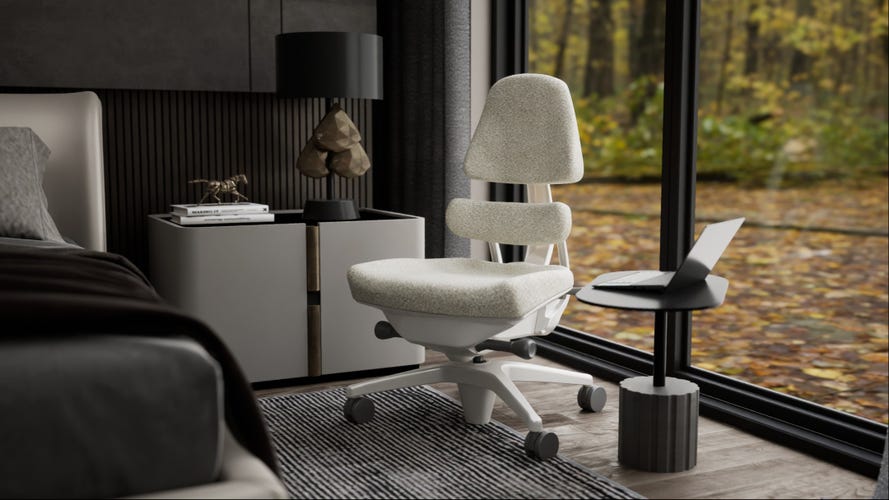 A white chair in a bedroom with an autumn leaves through the windows