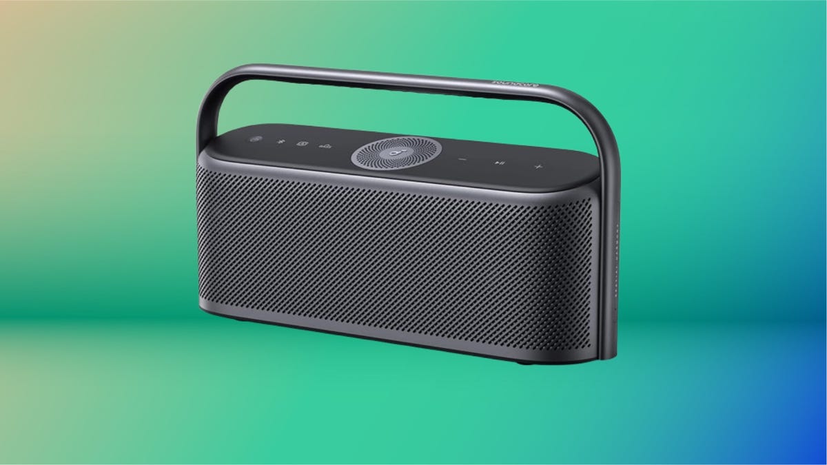 A gray Bluetooth speaker against an abstract blue and green background.