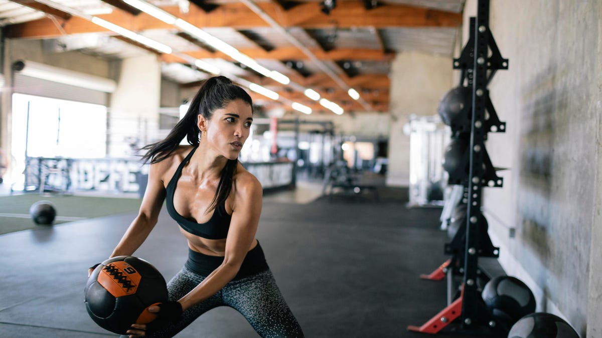Woman exercising wall ball