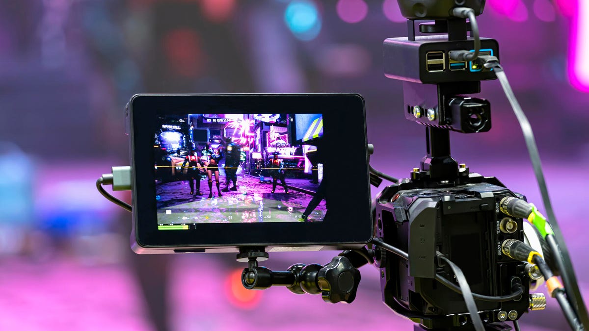 A video camera shoots a scene.