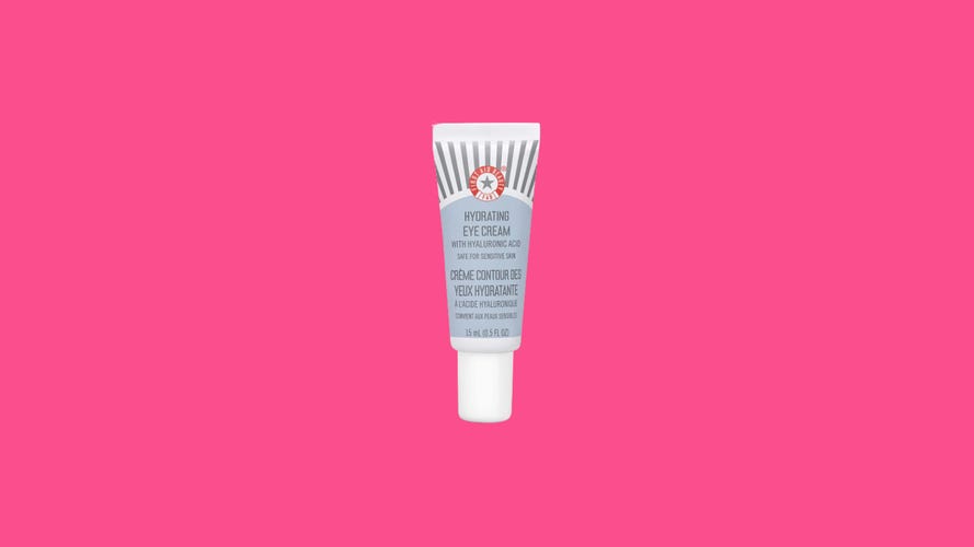First Aid Beauty Hydrating Eye Cream on colorful background.