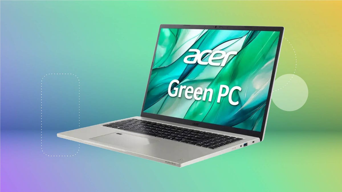An open Acer laptop against a purple, green and yellow gradient CNET background.