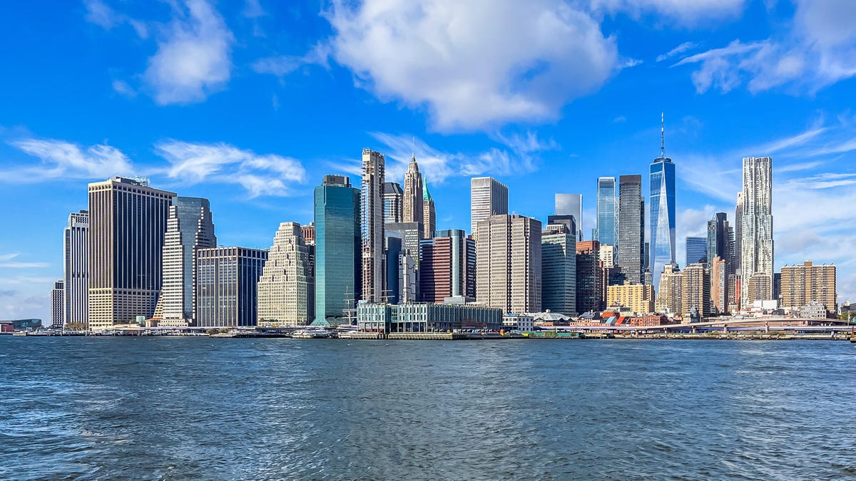 This sunny East River view features the lower Manhattan skyline.