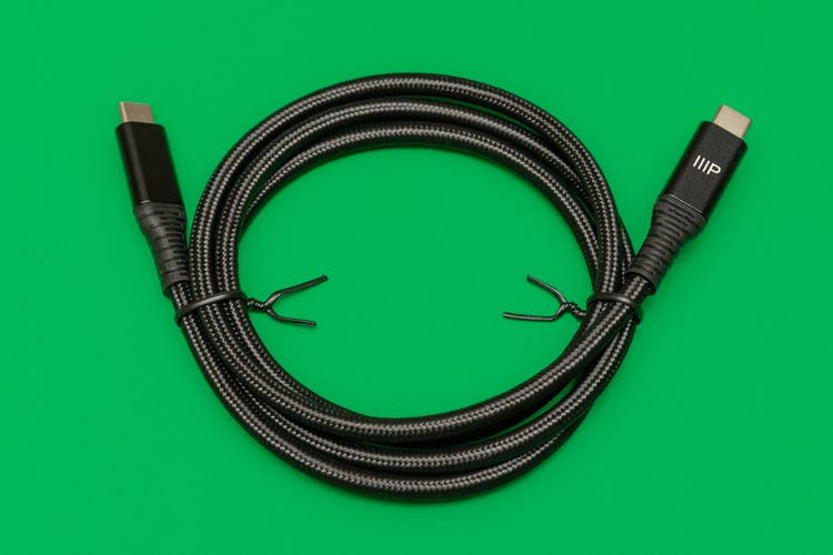Monoprice's AtlasFlex USB-C charging and data cable, coiled on a green background