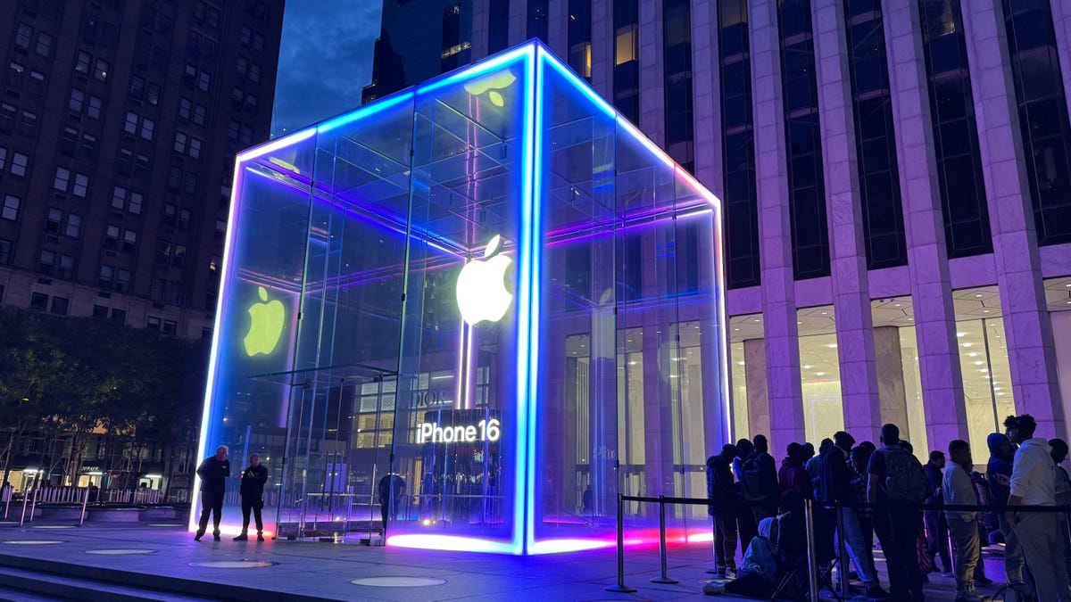 neon-lit cube at Apple's flagship NY store