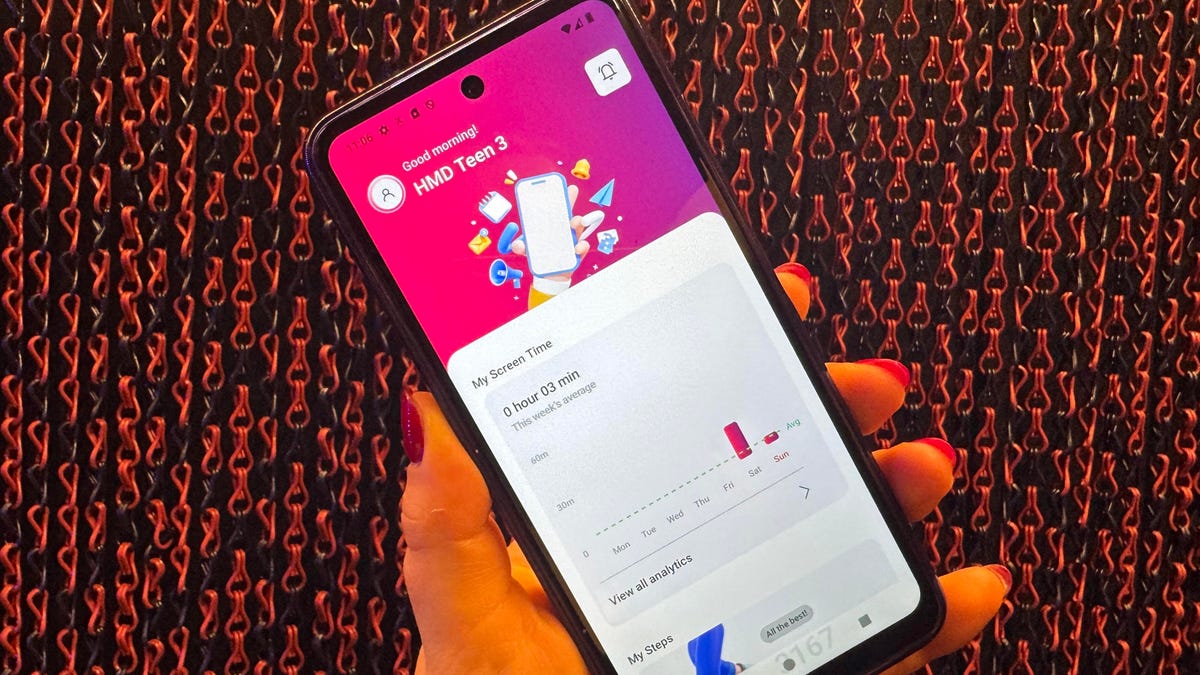 A hand holding the Fusion X1 phone