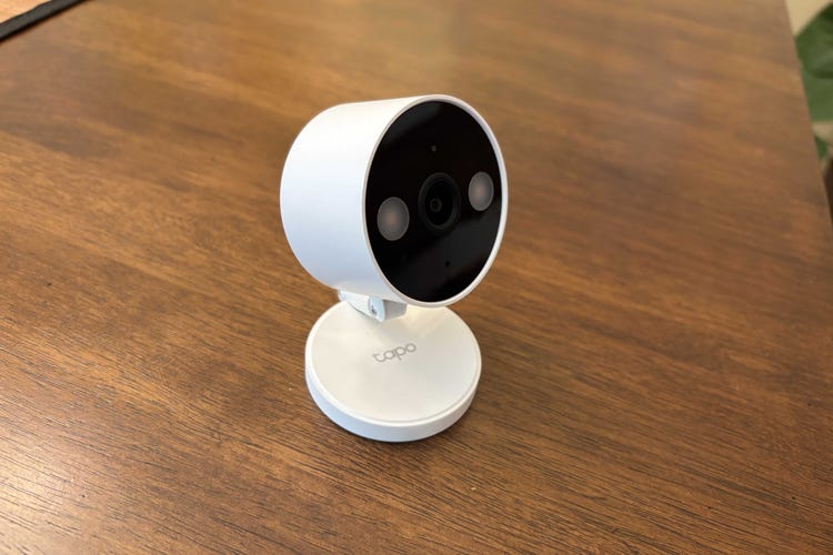 A Tap C120 cam on a wood table.