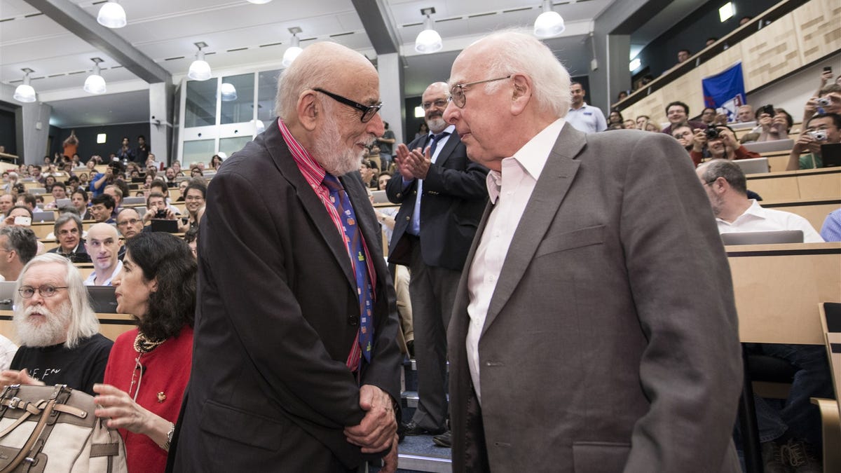 Francois Englert and Peter Higgs meet at CERN in 2012 during an announcement of the discovery of the Higgs boson. The discovery came nearly 50 years after they proposed the theory behind it in independent papers that led to their being awarded the 2013 Nobel Prize for physics.