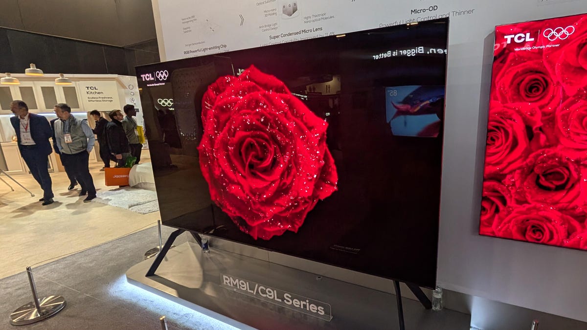 TCL RGB TV on a stand that reads RM9L