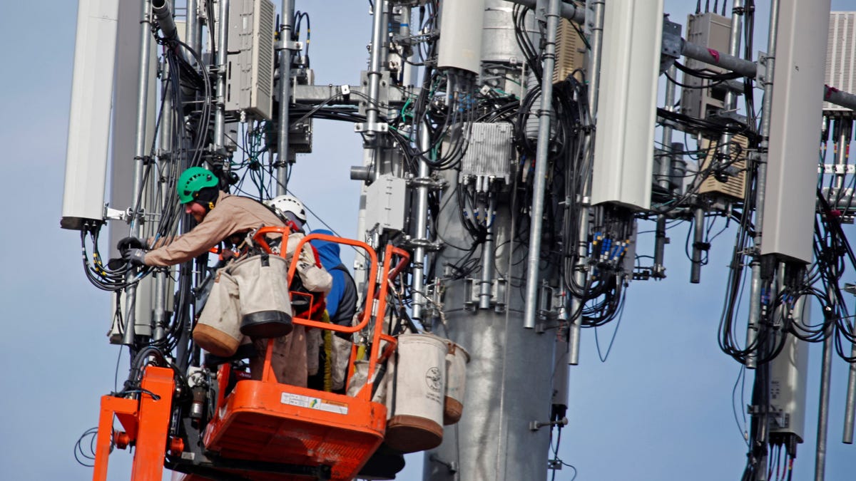 A Verizon crew works on a cell tower in Orem, Utah, in December 2019 to update it to handle the 5G network.
