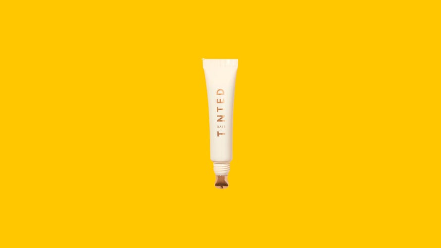 Live Tinted Superhue Brightening Eye Cream on colorful background