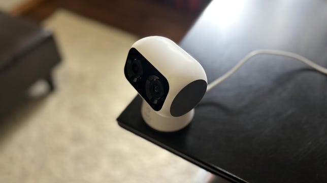 The Eufy S350 dual-cam perched at the corner of a black desk.