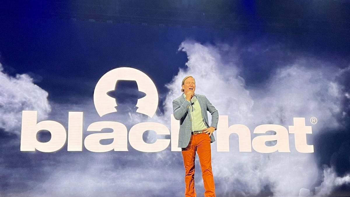 A picture of former CISA Director Chris Krebs speaking at the Black Hat conference.