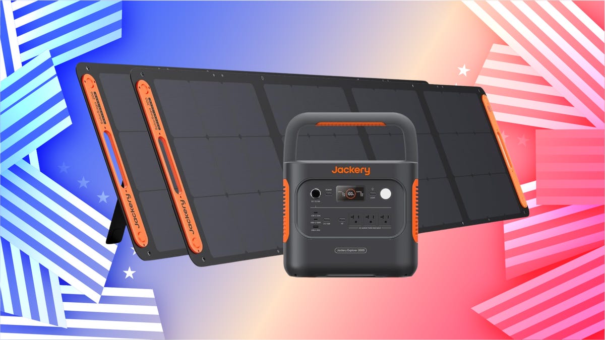 The Jackery Solar Generator 2000 v2 generator bundle is displayed against a red, white and blue background.