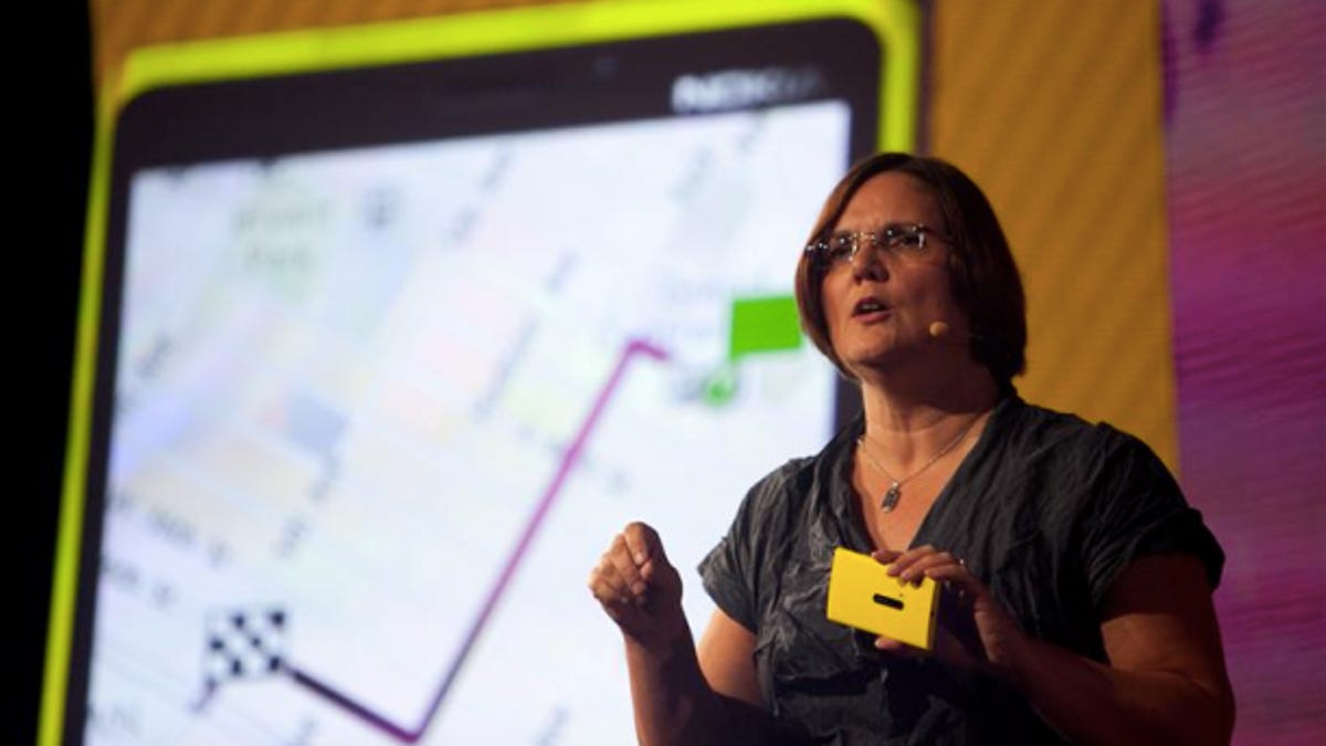 Nokia executive vice president of smart devices, Jo Harlow, holds aloft the Lumia 920.